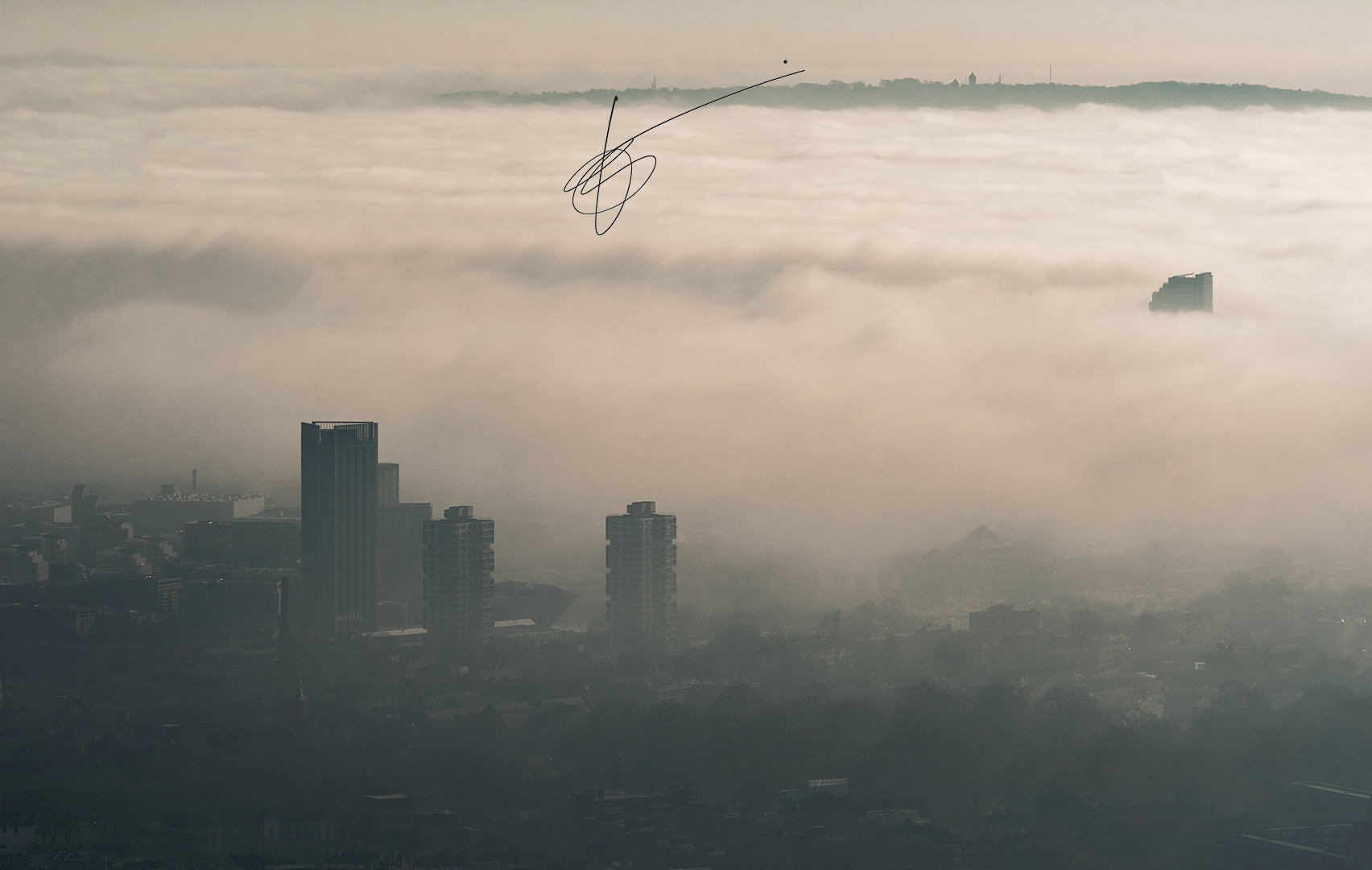 panorama of East London surrounded by fog