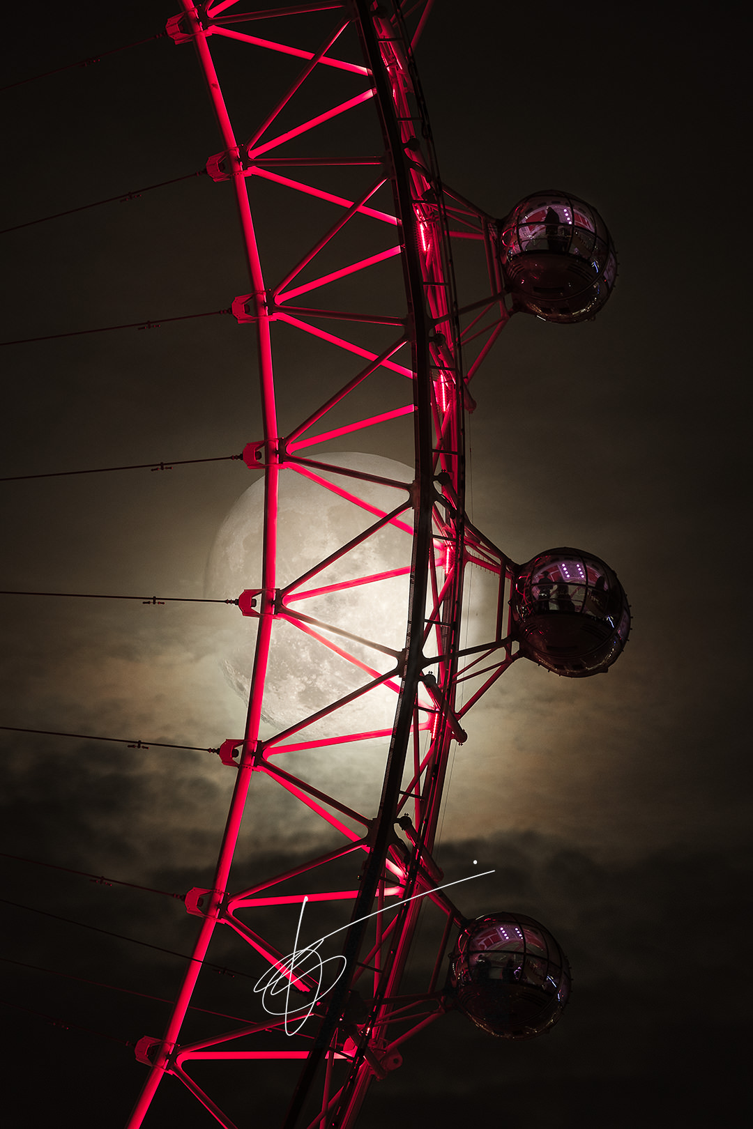 The Super Snow moon behind the London Eye