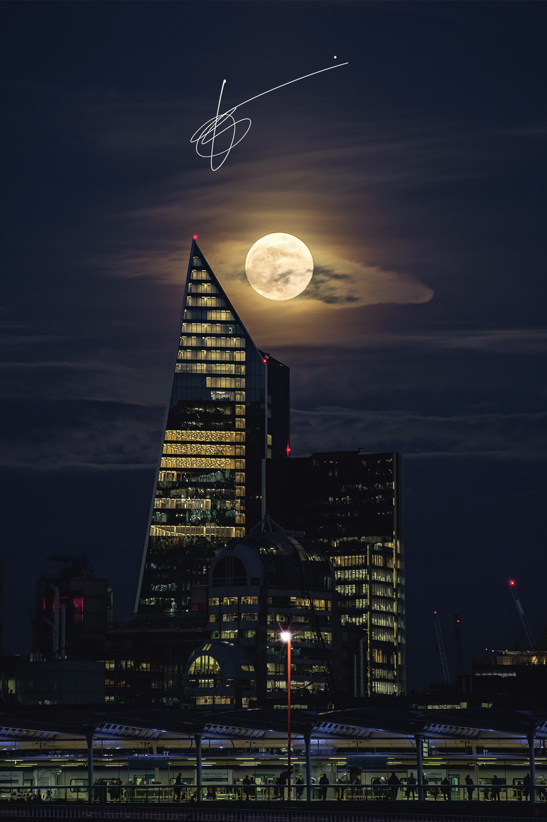 The Super Snow Moon rising above the Scalpel building in London