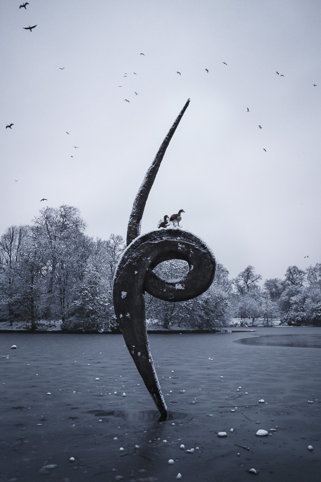 Xmas snow in London, Victoria Park, sculpture and birds on the frozen lake