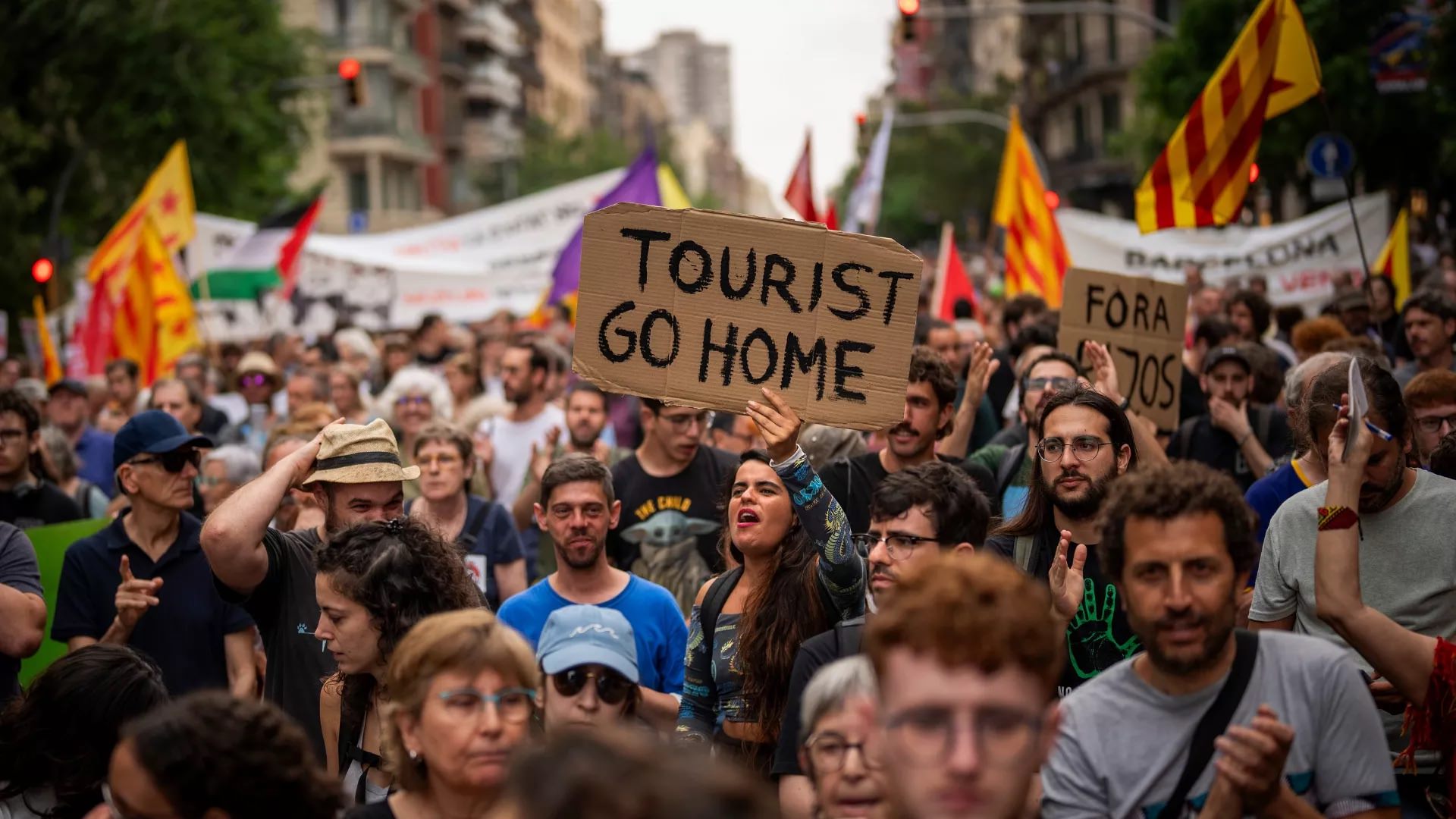 Barcelona residents protest against tourists, one of the side-effects of tourism